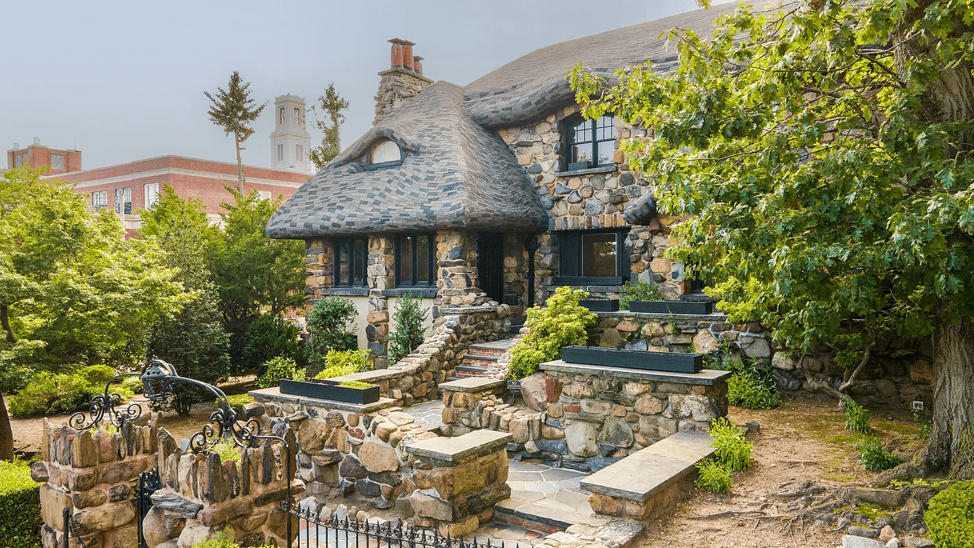 view of house from the street with stone steps