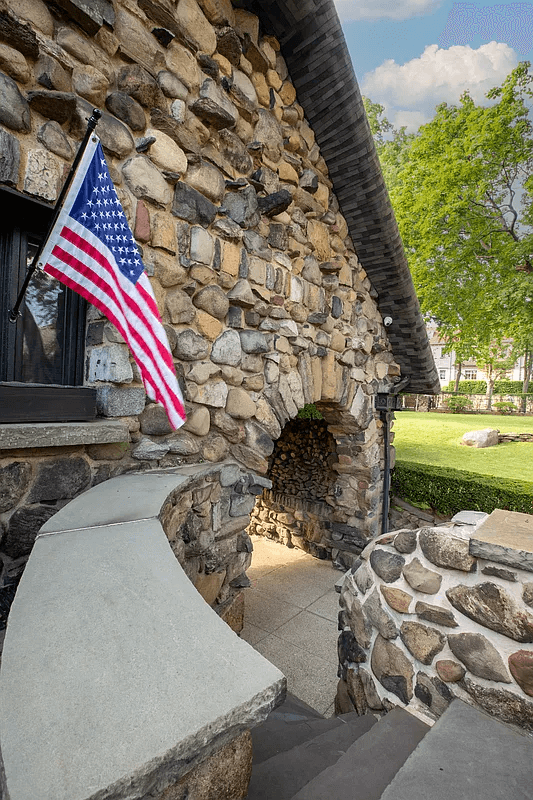 steps down to the arched access to parking