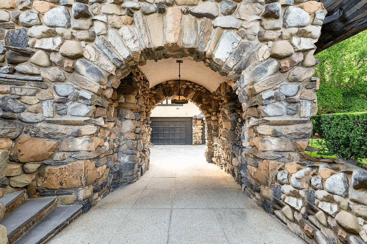 arched stone entrance to parking