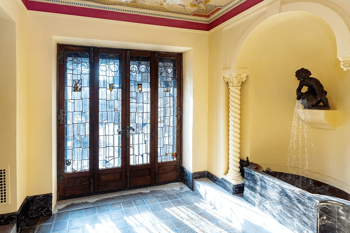 french doors and an indoor water feature