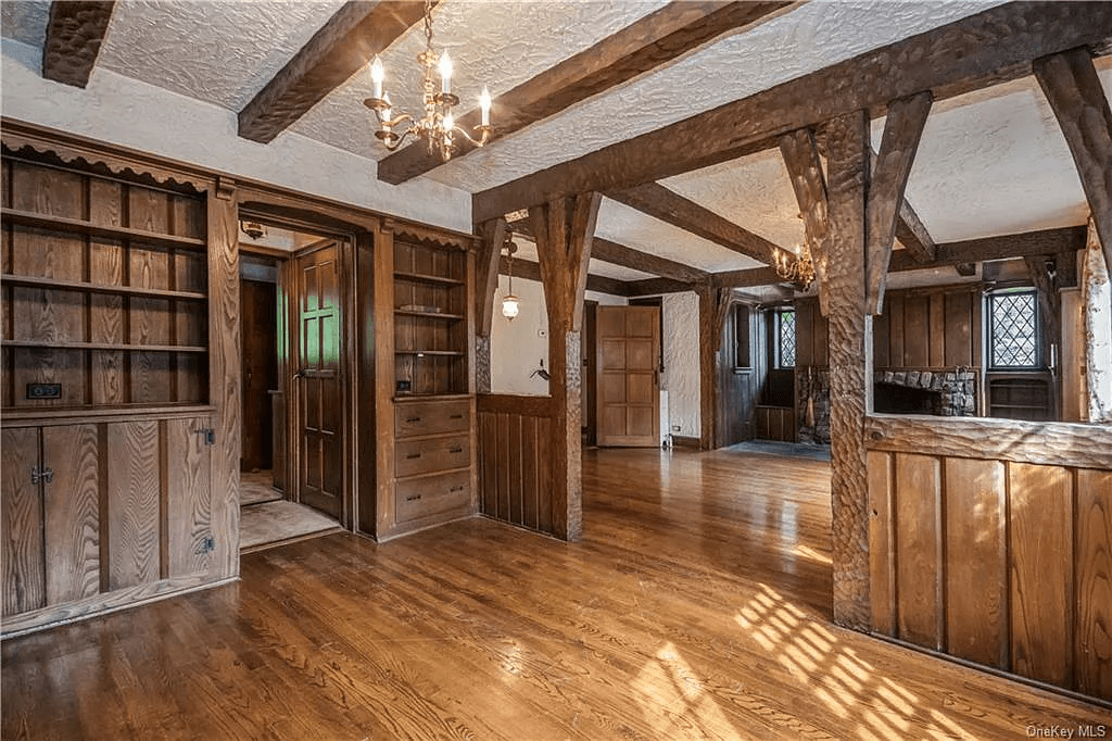 dining room with built-ins and beamed ceiling