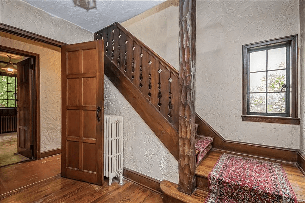 entry hall with wood stair and white walls