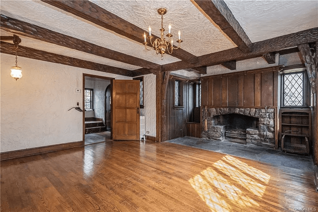 view from living room into entry with staircase