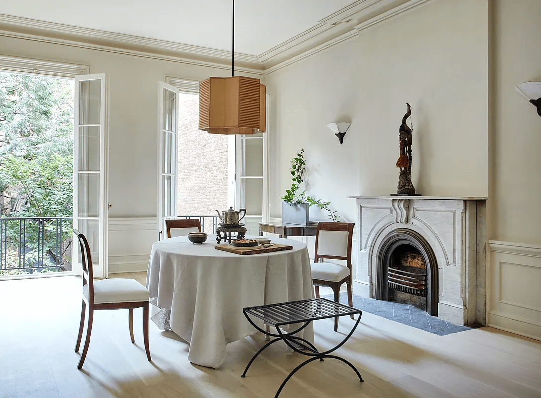 dining area in middle duplex with french doors to balcony