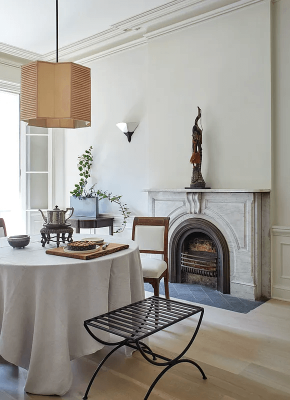 dining area in the middle duplex with marble mantel