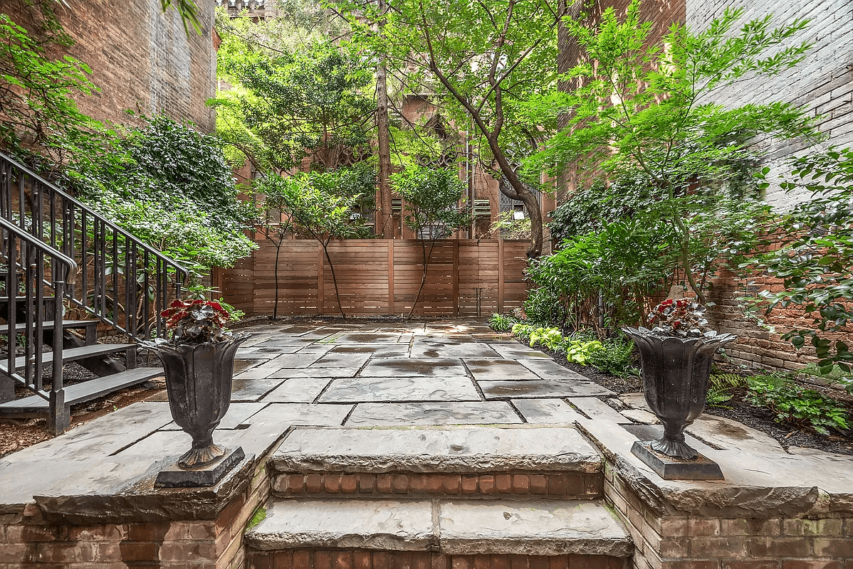 paved raised garden with planting beds