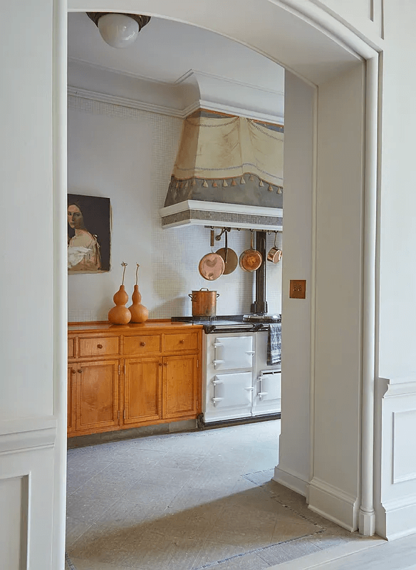 view through an arched opening into the kitchen in the middle duplex