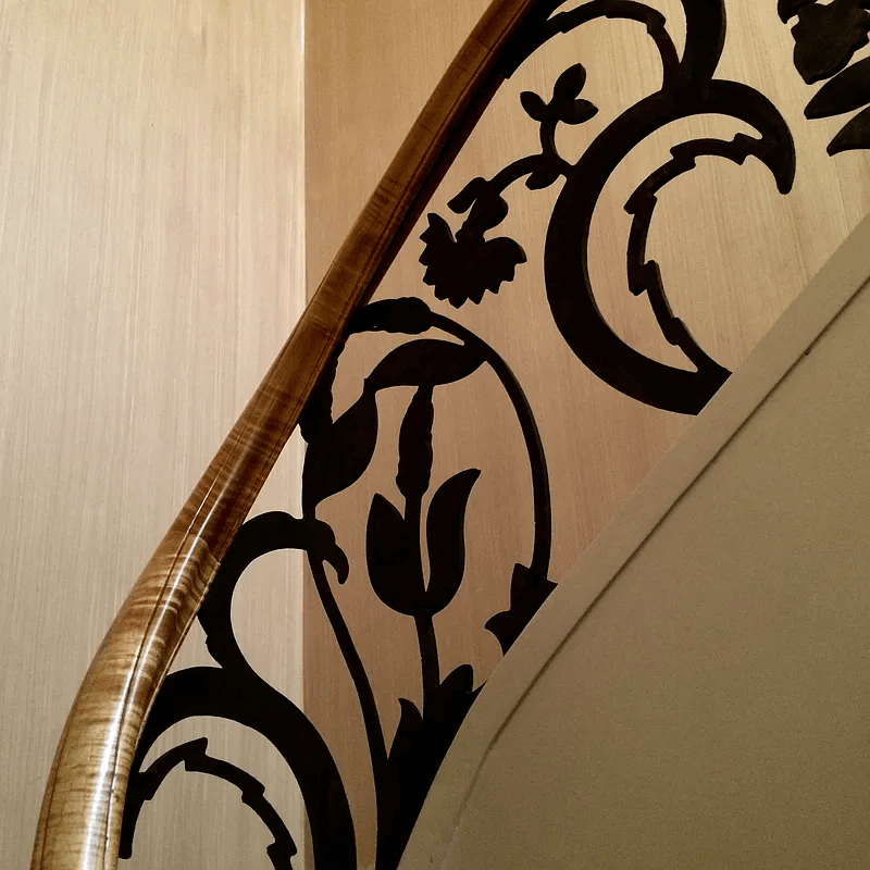 detail of iron stair with abstract floral pattern