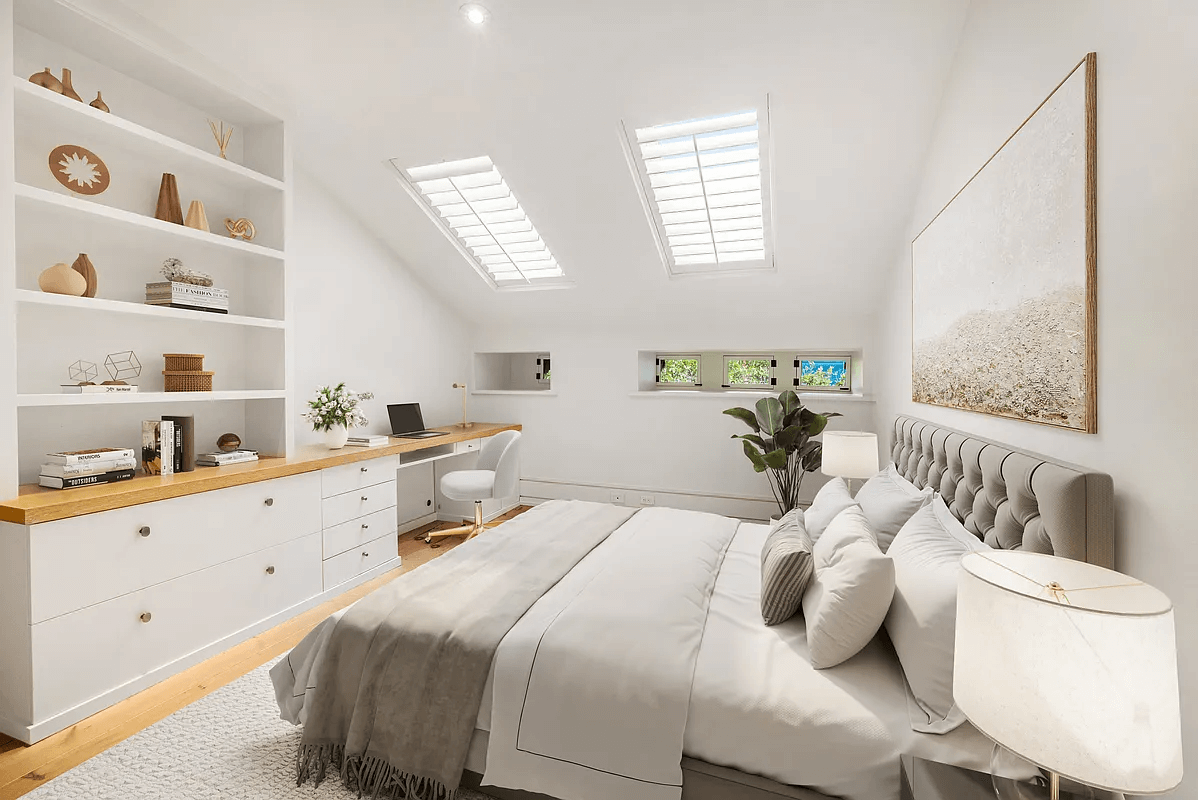 top floor bedroom with skylights and clerestory windows