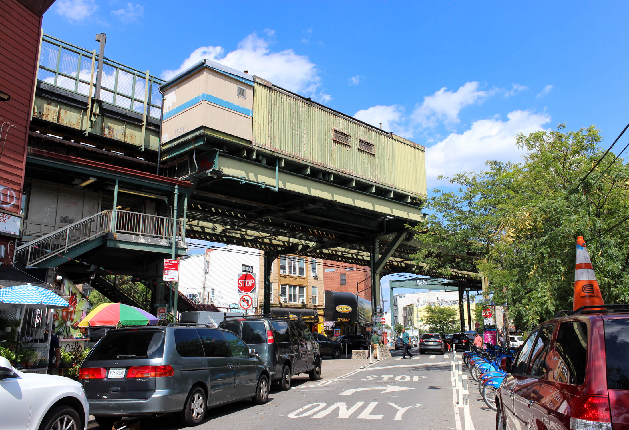 bushwick street view with an elevated train platform