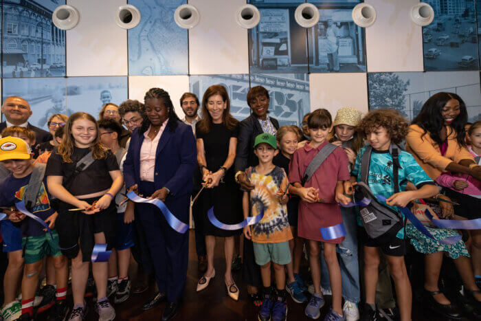 group of people cutting the opening ribbon