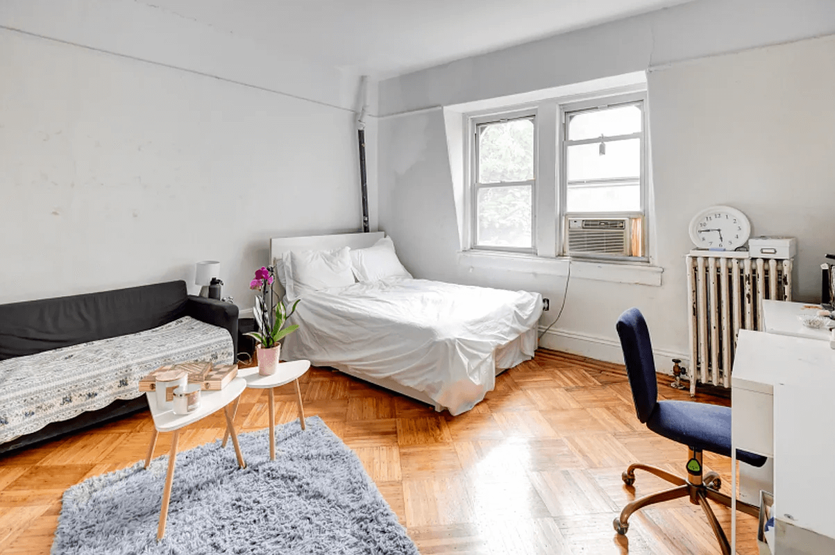 living room and bedroom with wood floors and picture rails