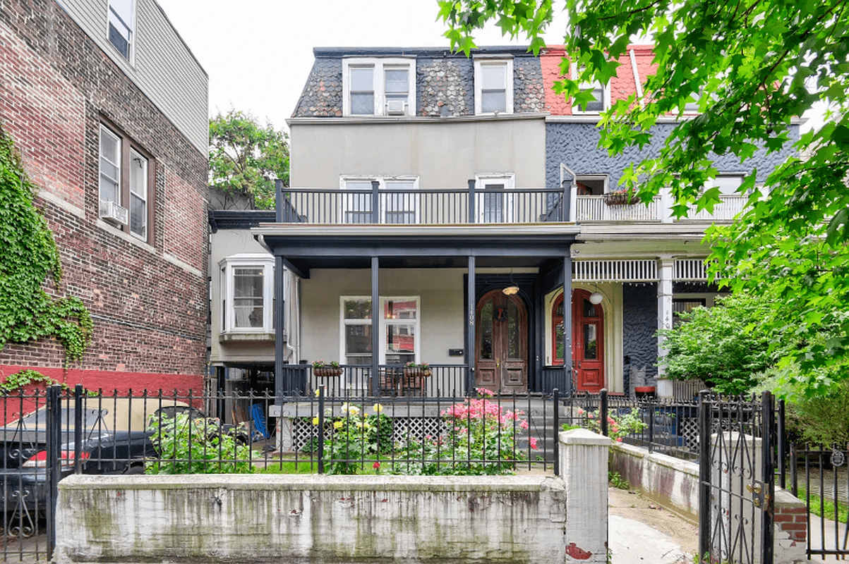 exterior with stucco facade and front yard