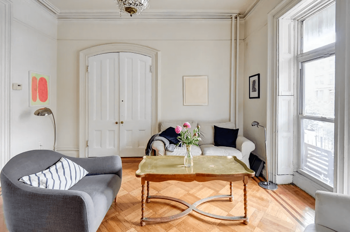 parlor with arched doorway and picture rails