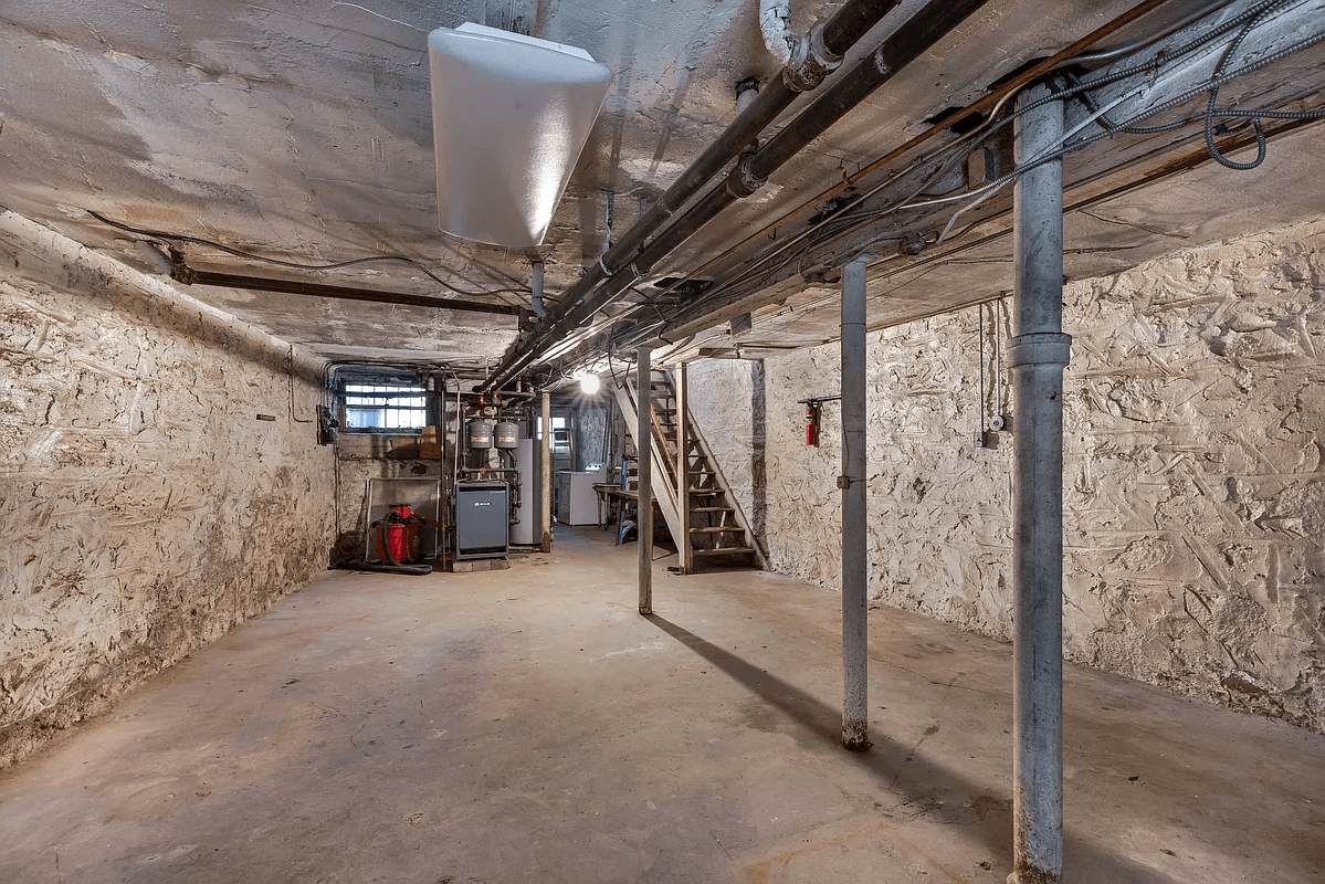 unfinished basement with view of mechanicals