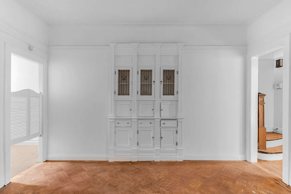 dining room with built-ins with stained glass doors