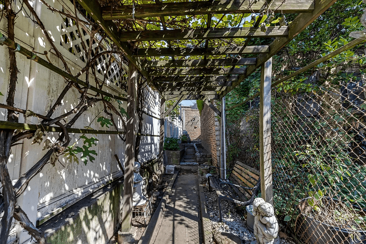narrow walkway in rear yard