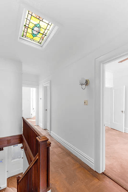 upstairs hall with stained glass skylight