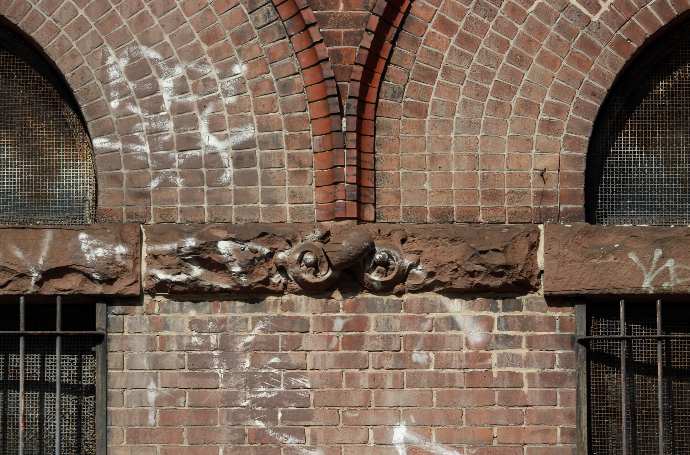 window detail showing brownstone beer barrel