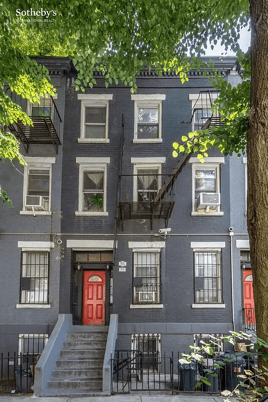 blue exterior of a brick row house