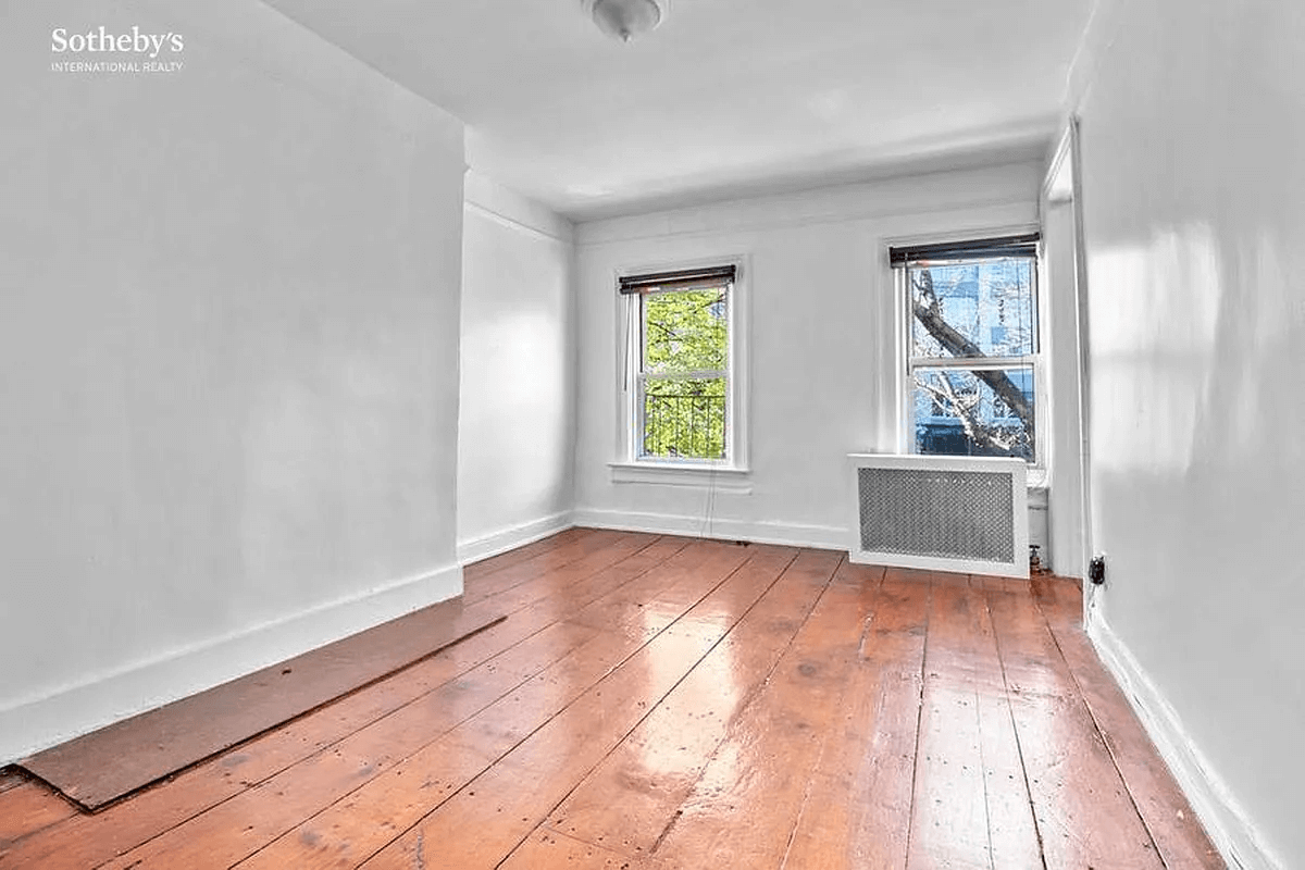 living room with wide planked floor boards