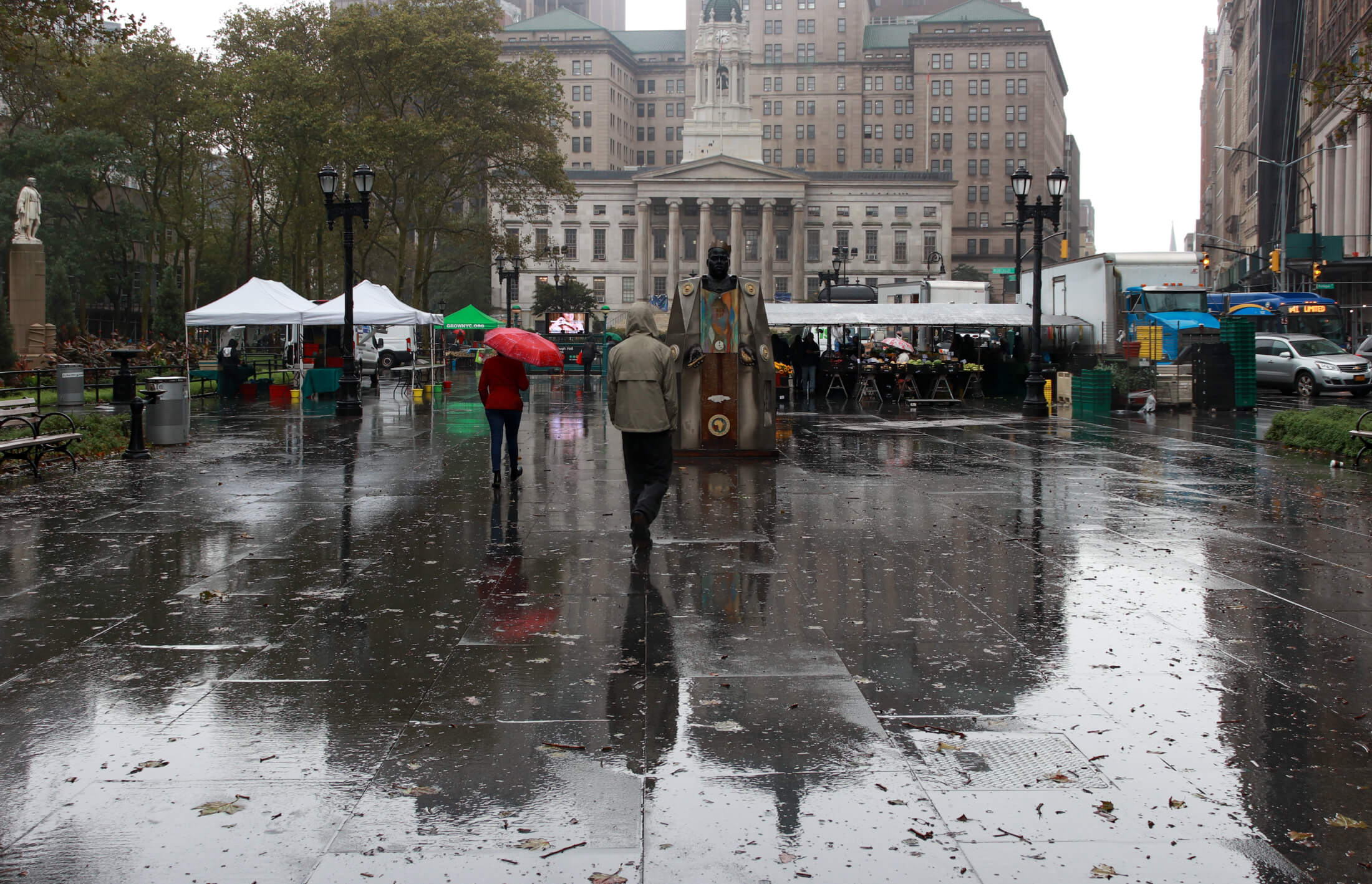 brooklyn - rain in downtown brooklyn with a statue of biggie smalls and borough hall in the background
