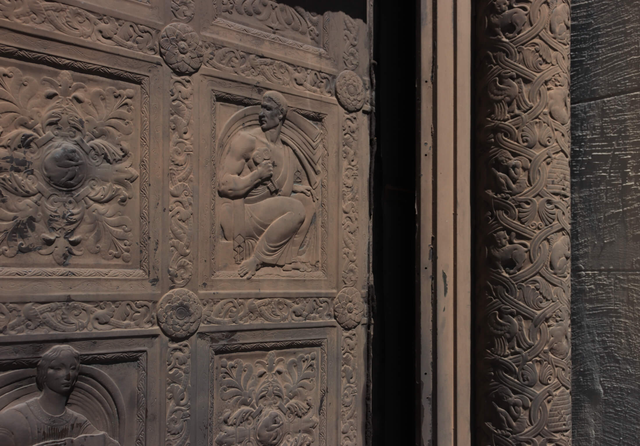 figures and floral patterns on the doors