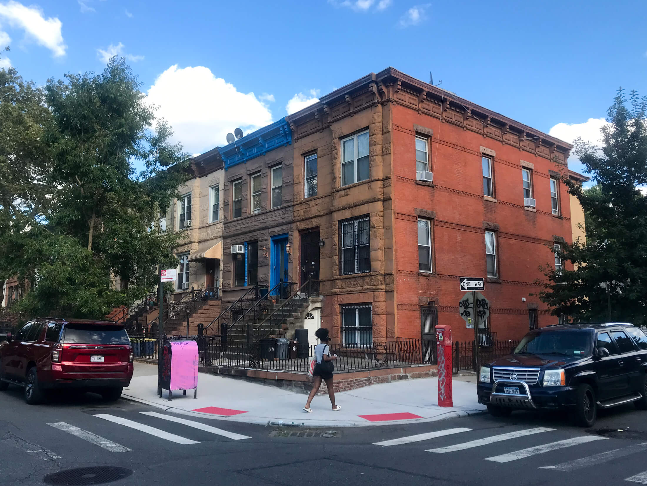 brooklyn - corner view of row houses and a pink mailbox