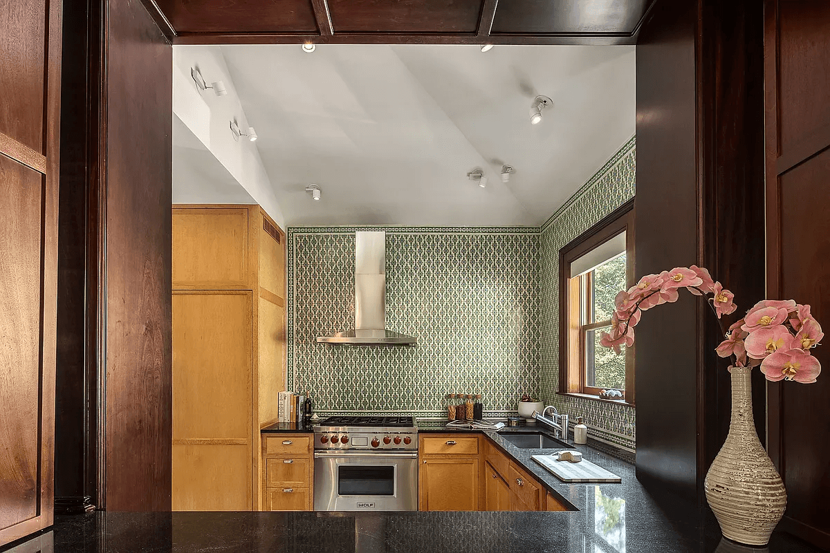 view from passthrough in the dining room into the kitchen