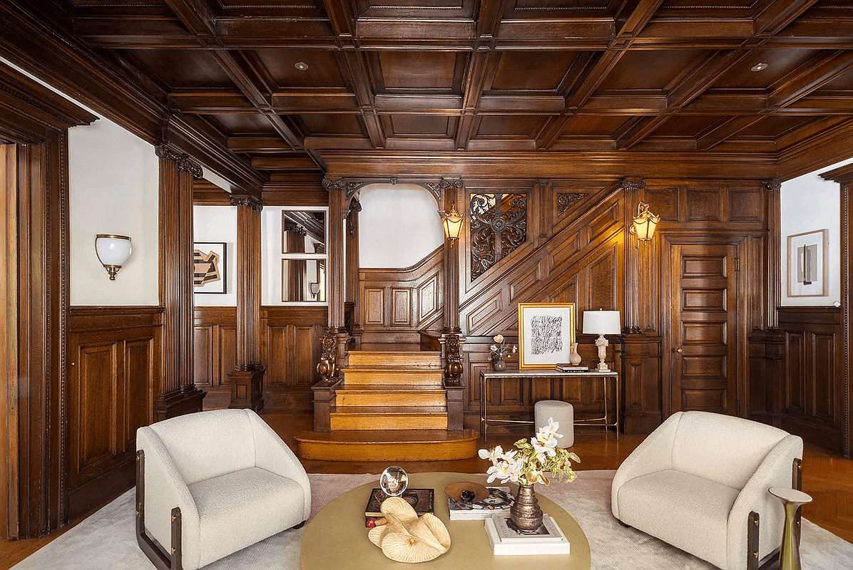 wood filled middle parlor with wainscoting, coffered ceiling, original stair