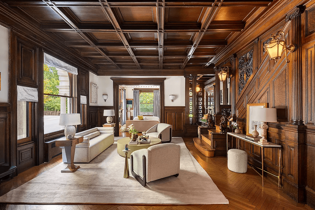wood filled middle parlor with wainscoting, coffered ceiling, original stair