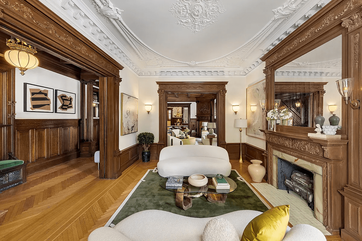 parlor with mantel, plaster details and wainscoting