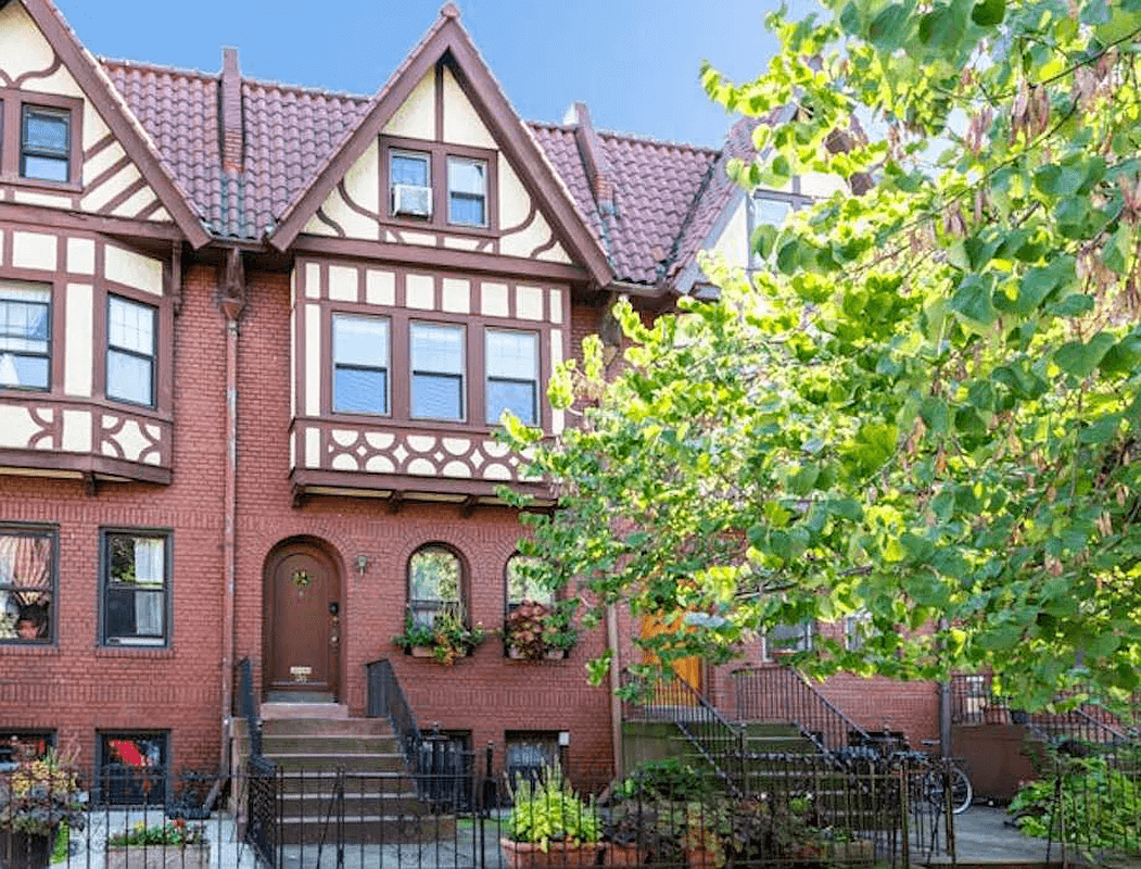 tudor revival style exterior with half timbering and a tile roof