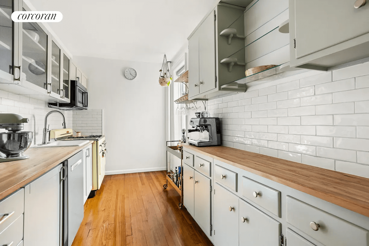 kitchen with butcher block countertops and white subway tile backsplash
