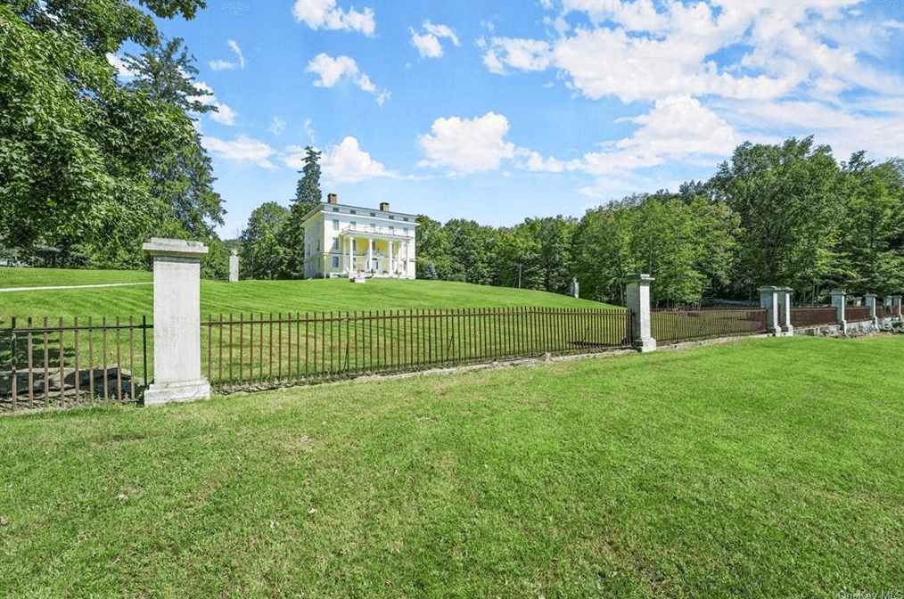 view of iron fence surrounding the house