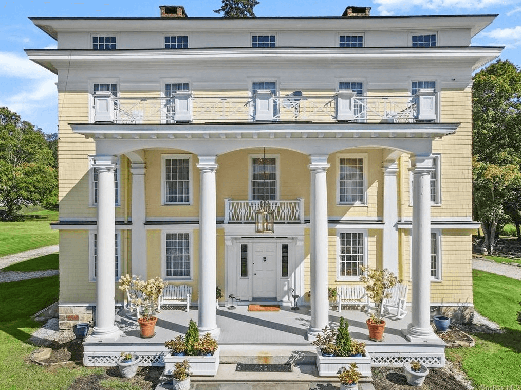 yellow house exterior with columned portico