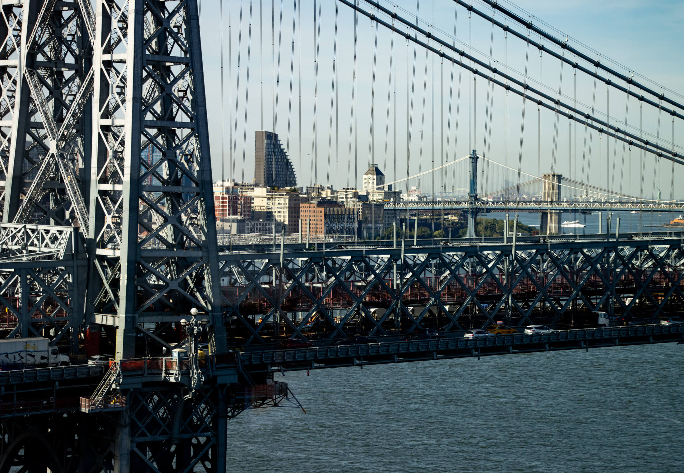brooklyn - view through the williamsburg bridge to the manhattan and brooklyn bridges
