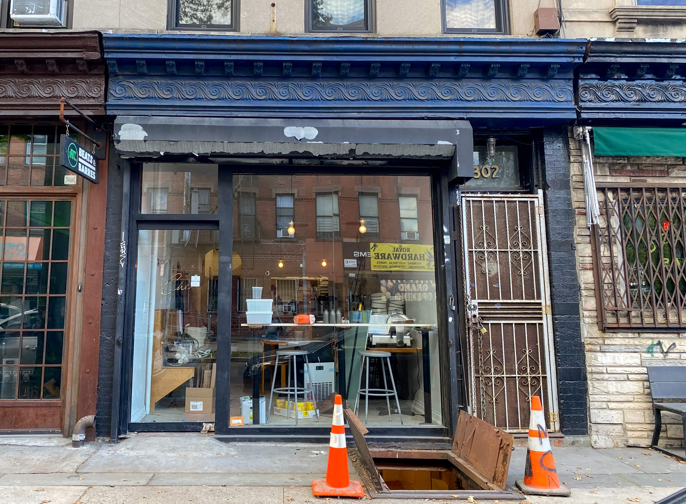 brooklyn restaurant exterior with blue painted trim and gold lettering on glass door