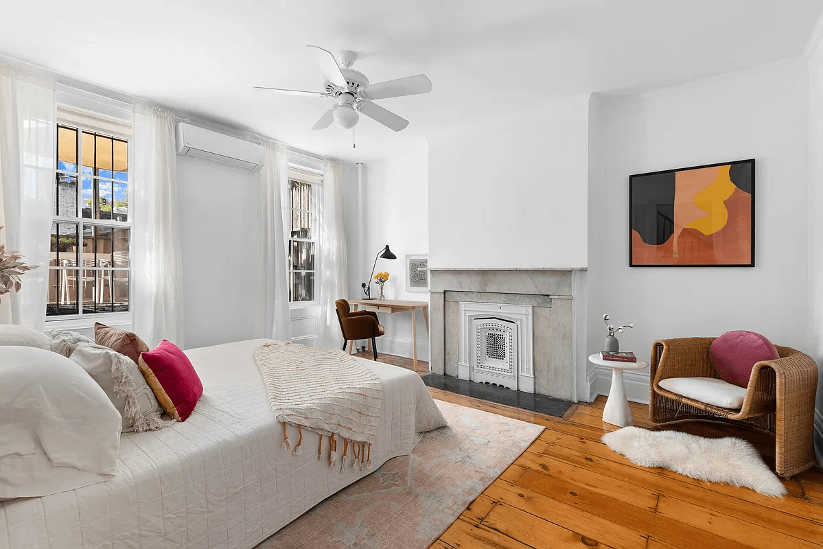 second floor bedroom with marble mantel and view to terrace