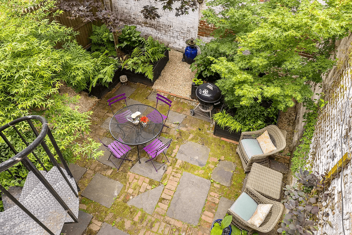 rear yard with stone and brick patio