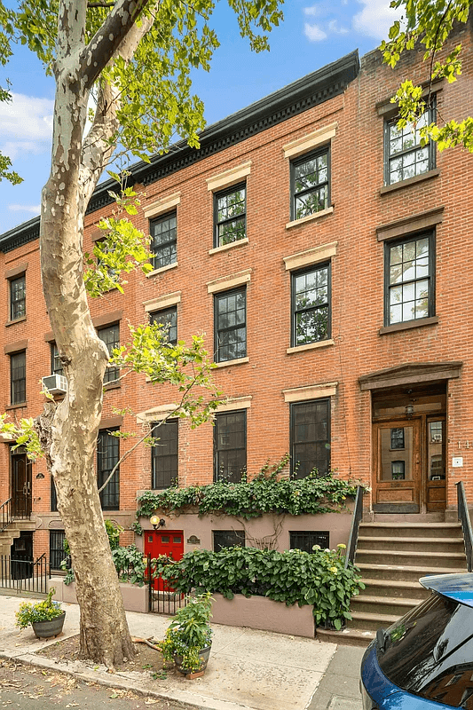 brick row house with brownstone base