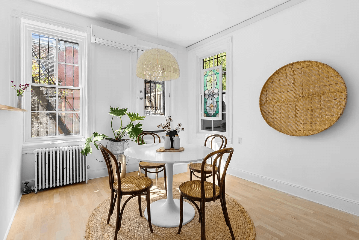 dining area with pale wood floors