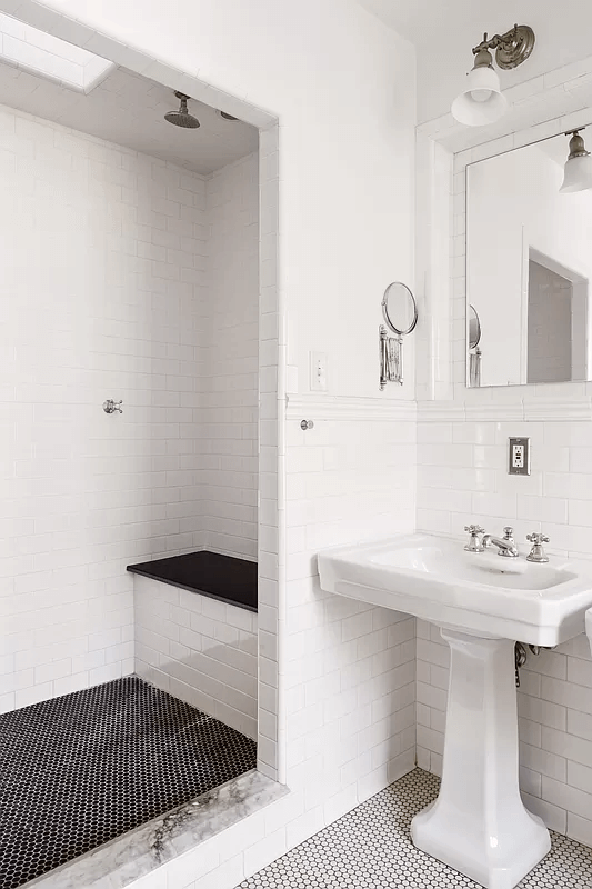 bathroom with built-in shower and white subway tile