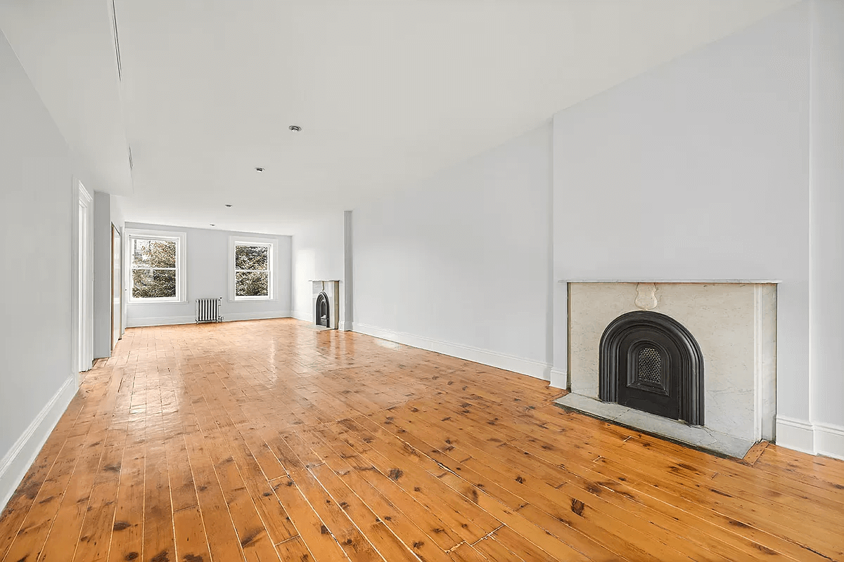 top floor with two mantels, wood floor