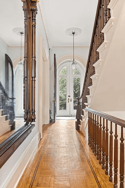 hall with wood floor with inlaid border