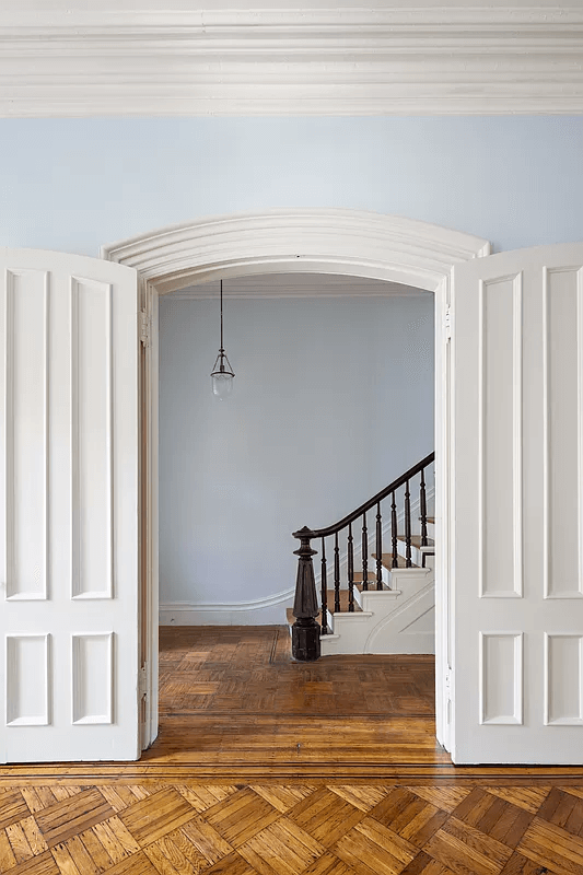 view to period newel post in hall