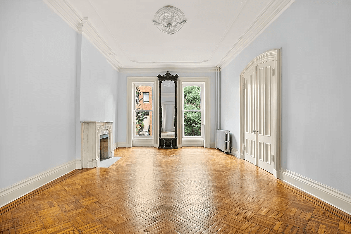 parlor with pier mirror, mantel and ceiling medalion