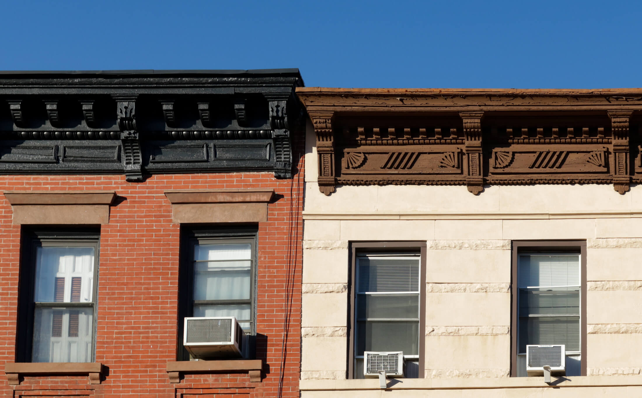 row houses with air conditioners in the windows