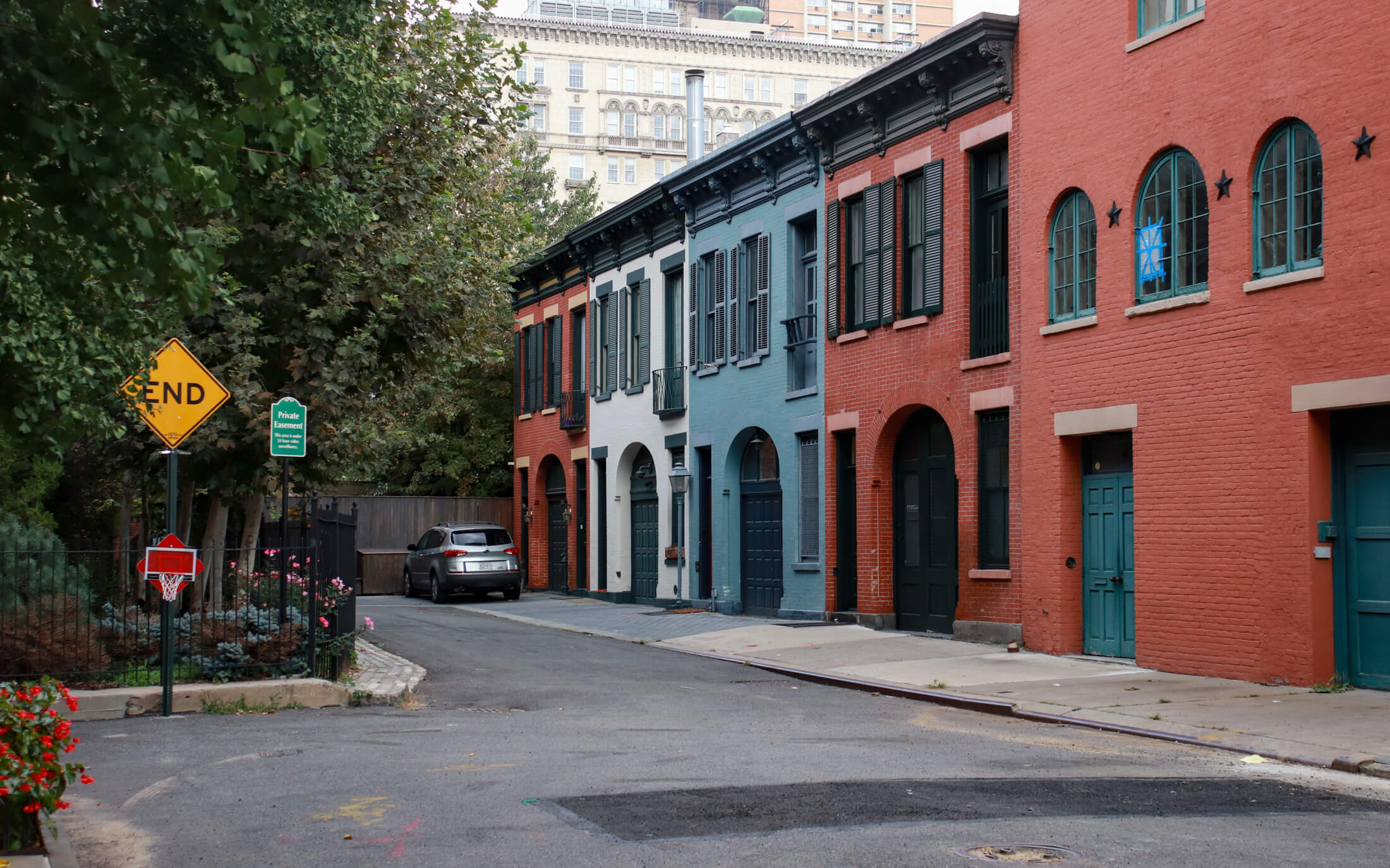 brooklyn - row of colorful brick carriage houses on college place