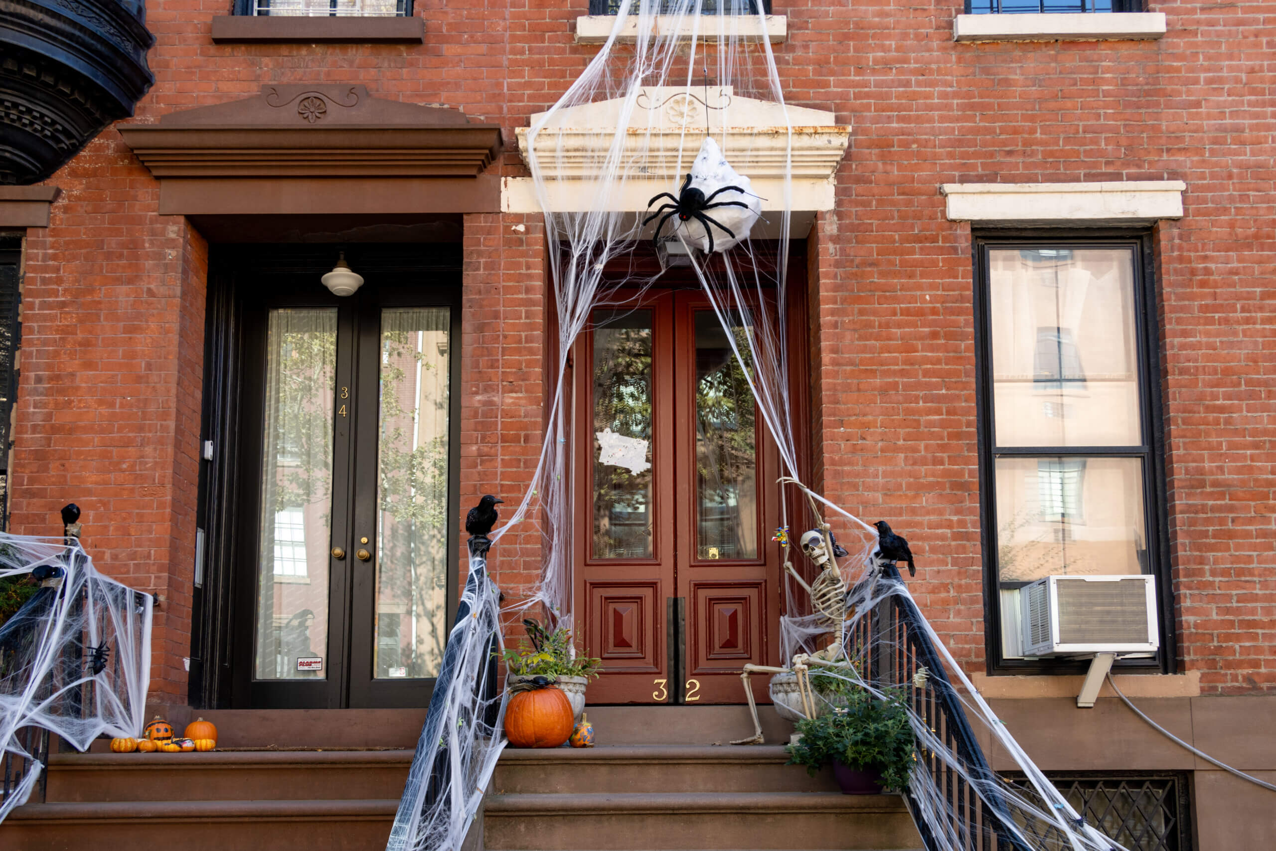 brooklyn - spiderwebs and halloween decorations on a brooklyn heights stoop